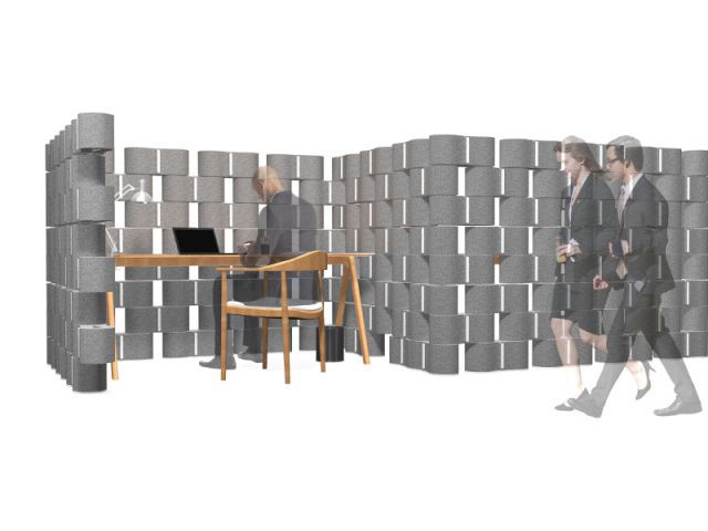 Un bureau enveloppé d'un mur en textile recyclé Un bureau enveloppé d'un mur en textile recyclé